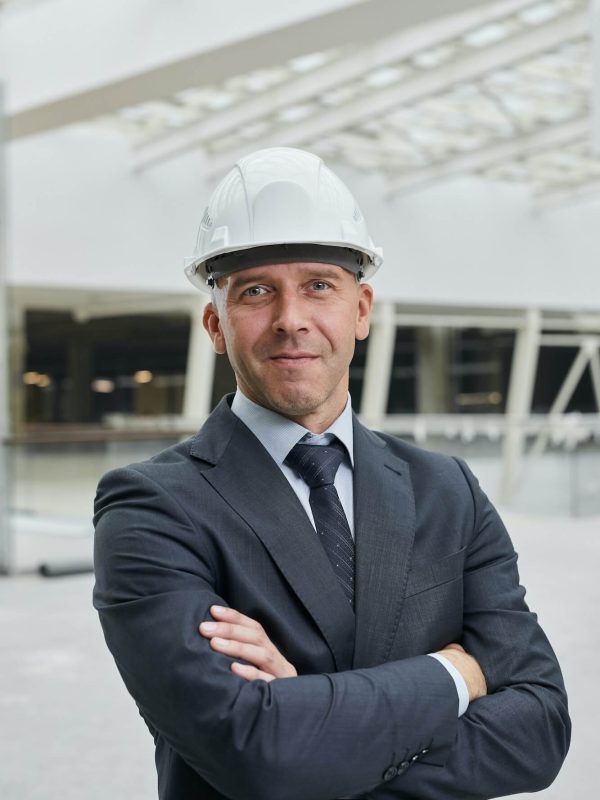 confident-businessman-at-construction-site-1
